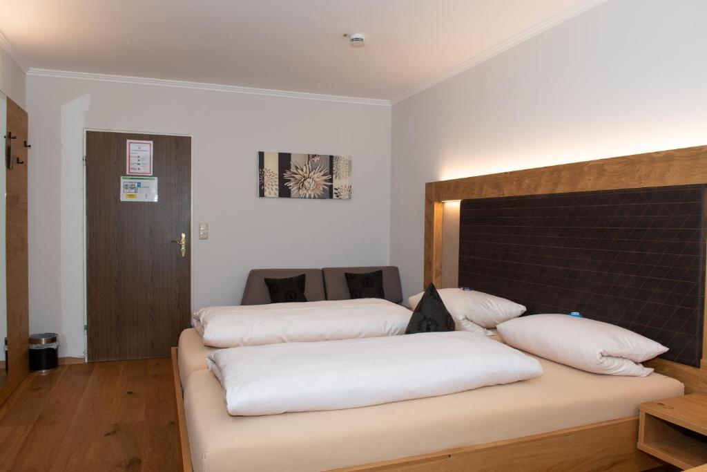 Postel nebo postele na pokoji v ubytování Hotel Bockmaier