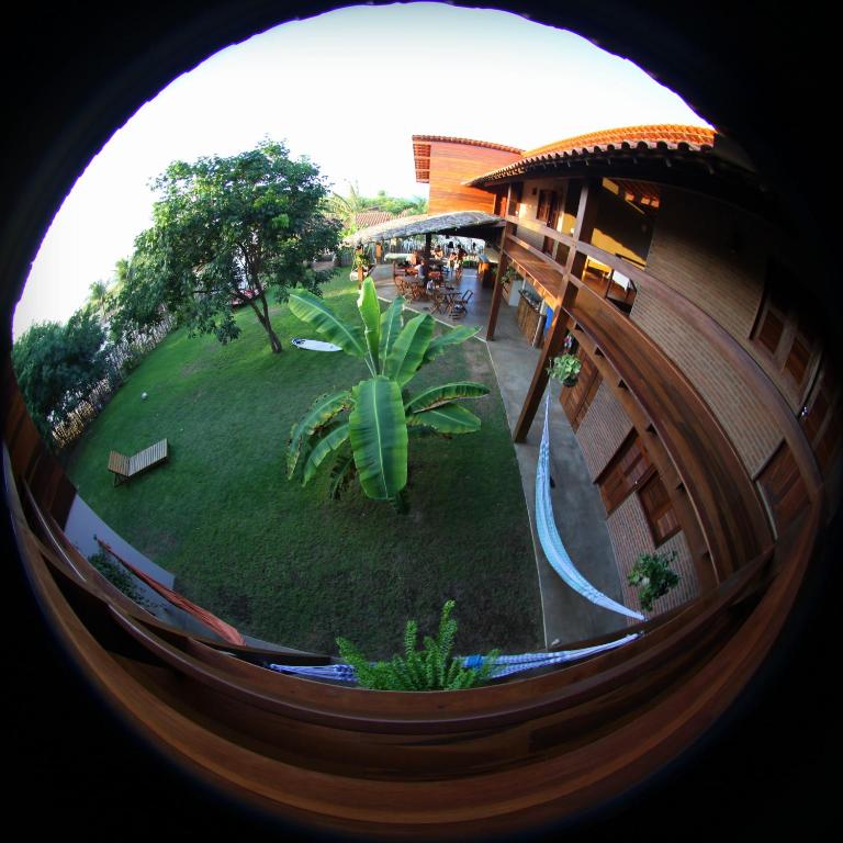 a circular view of a resort with a water slide at Jangada Lodge in São Miguel do Gostoso
