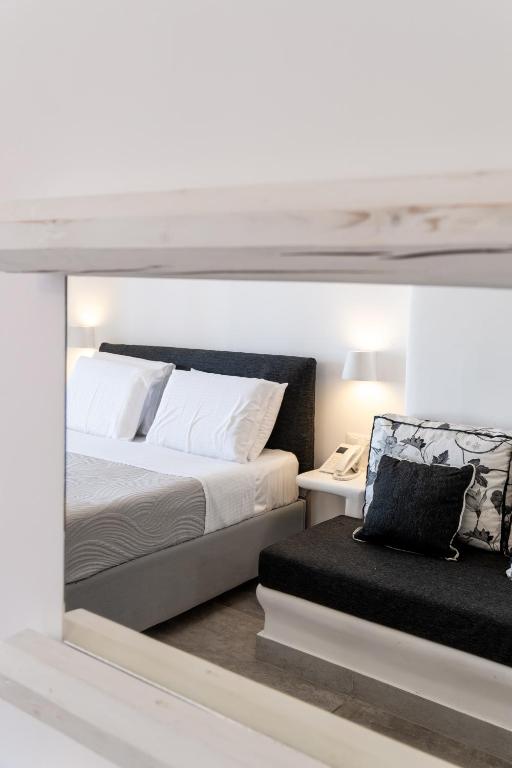 Postel nebo postele na pokoji v ubytování Amaze Suites