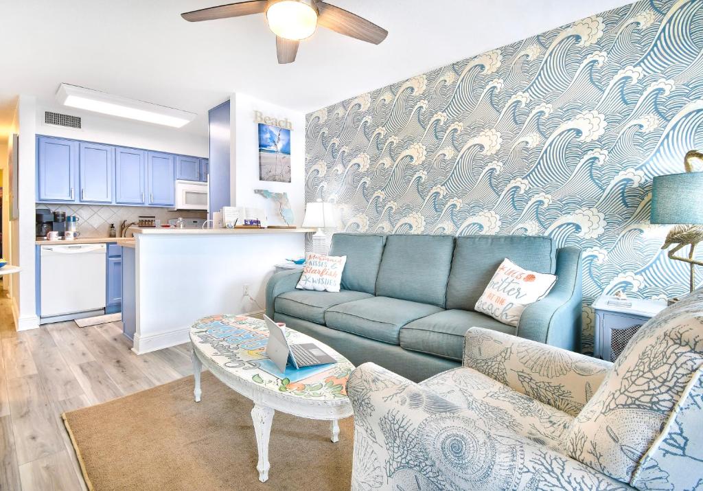 a living room with a couch and a table at Funshine Sunset Beach in St. Pete Beach