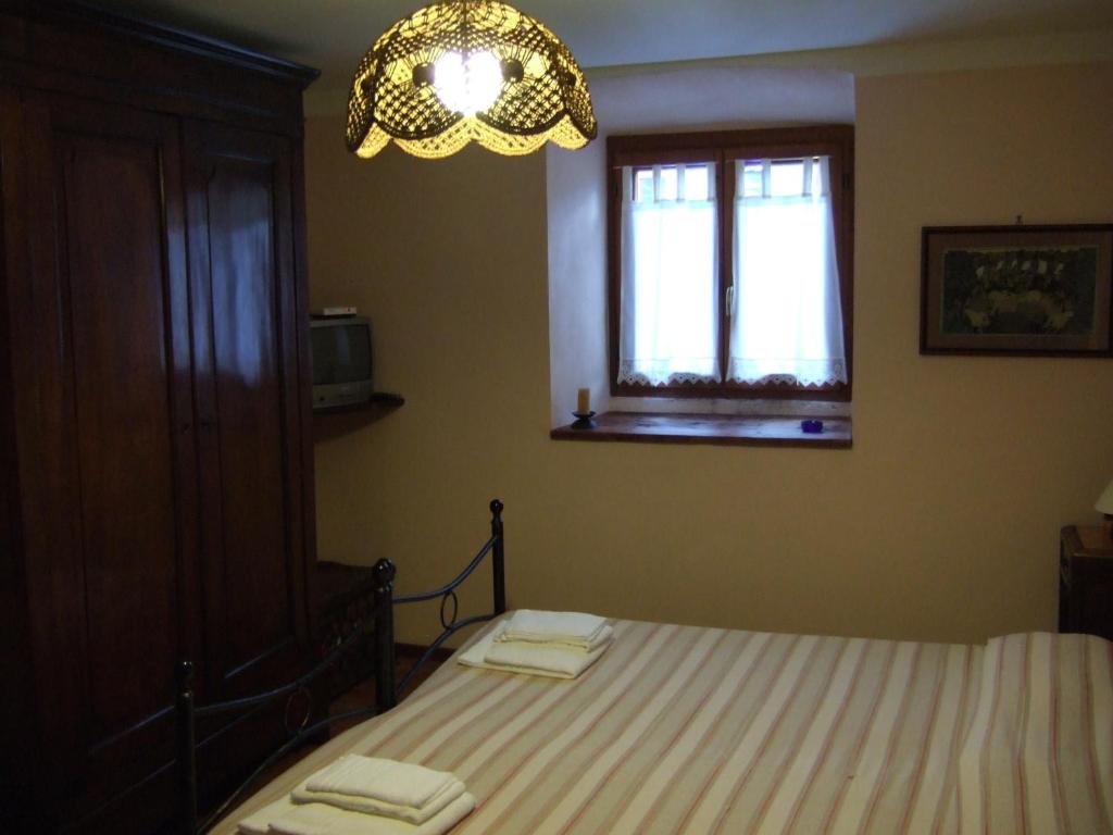 Postel nebo postele na pokoji v ubytování IL Dahù
