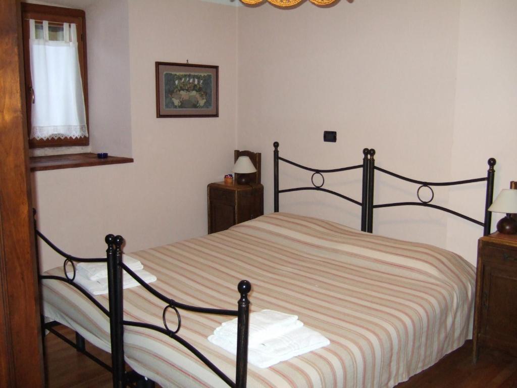 Postel nebo postele na pokoji v ubytování IL Dahù