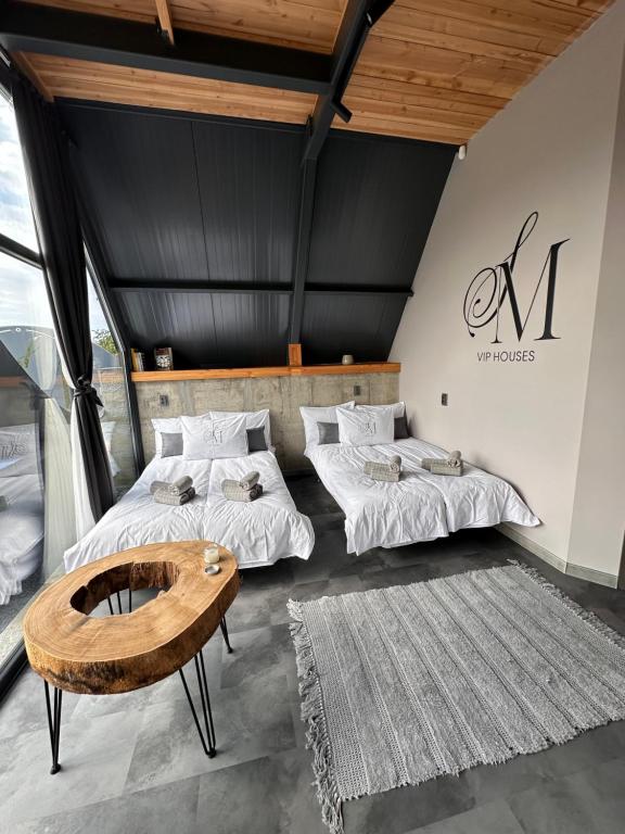 Postel nebo postele na pokoji v ubytování SM VIP HOUSES