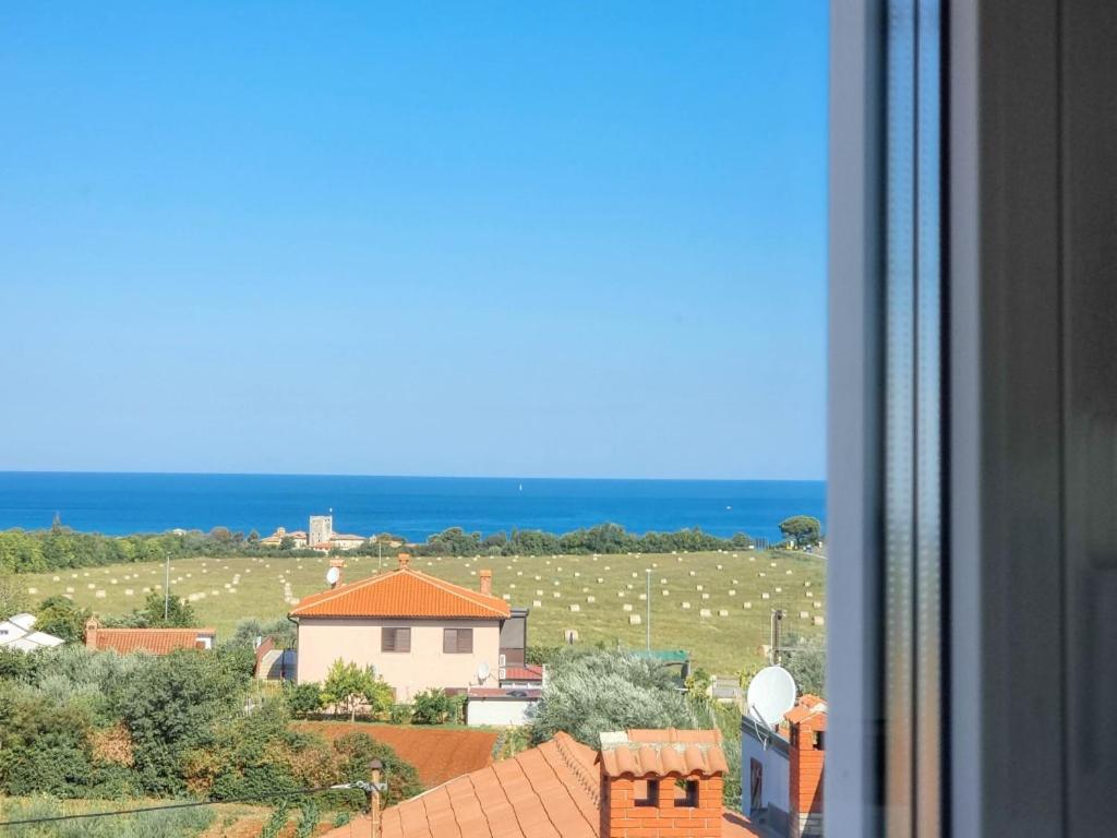 a view of the ocean from a window of a house at Silos Mare in Novigrad Istria