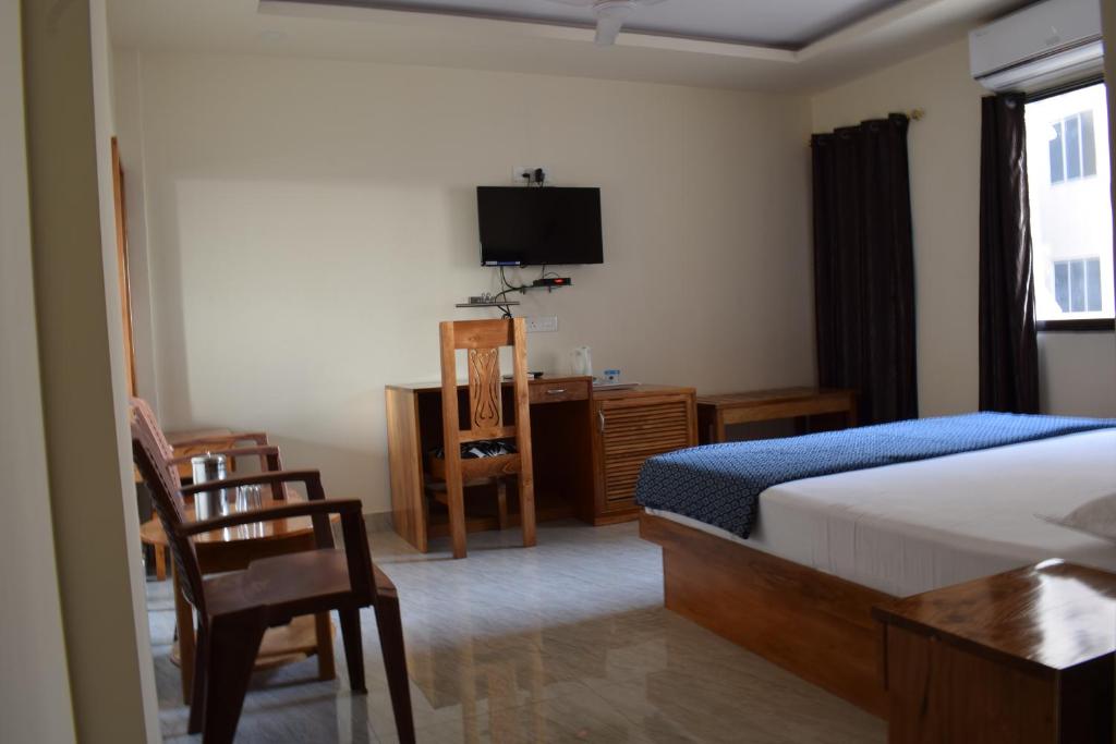 Postel nebo postele na pokoji v ubytování Hotel Abhishekh