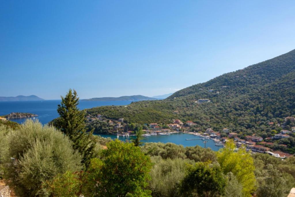 a view of a lake from a hill at VILLAS CARISMA - Natural Style Villas for 14 people in Sivota