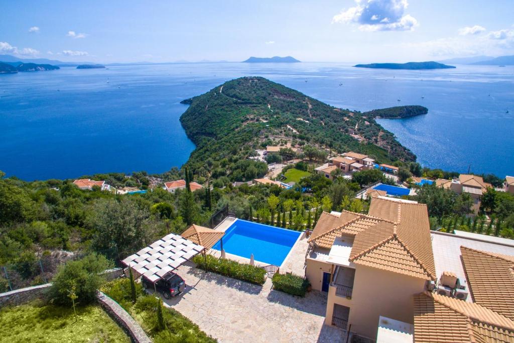 an aerial view of a house with a view of the ocean at Villa Columba - Luxury Private Villa in Modern Residence in Sivota