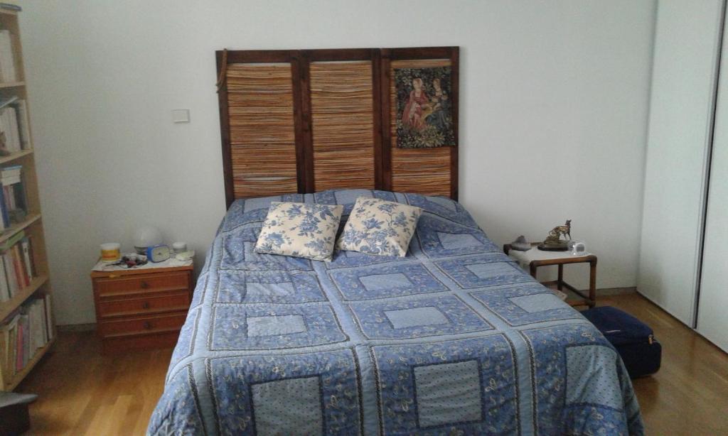 Giường trong phòng chung tại La MAISON VERTE