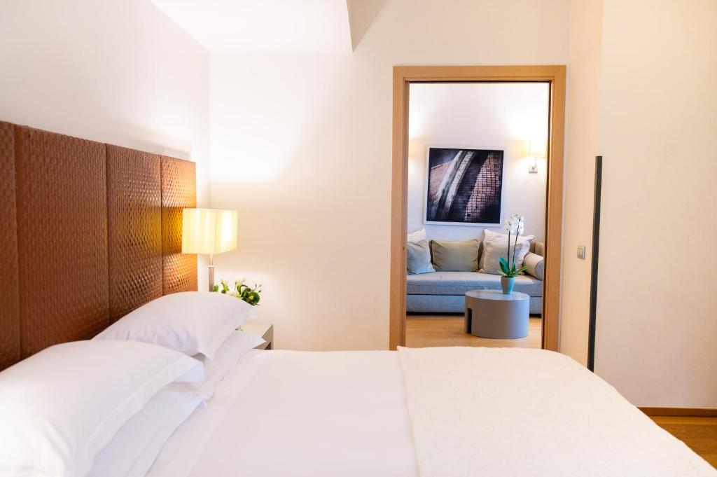Postel nebo postele na pokoji v ubytování Starhotels Michelangelo Florence