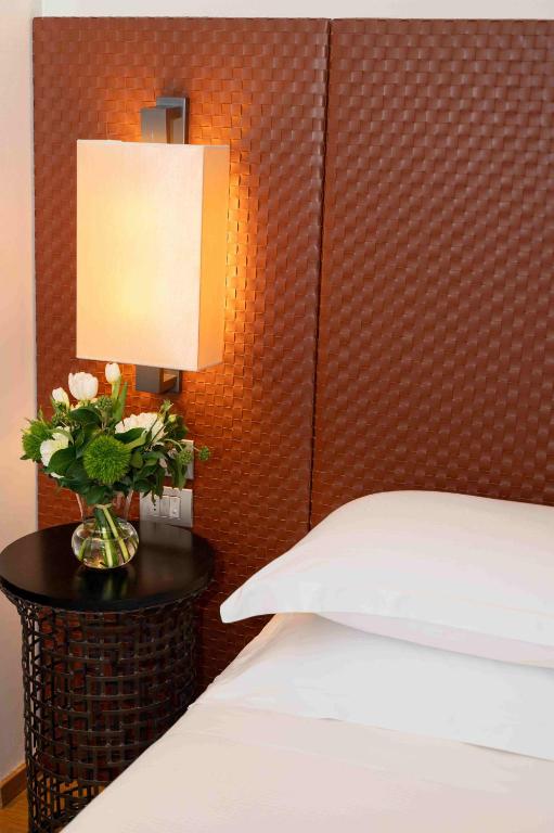 Postel nebo postele na pokoji v ubytování Starhotels Michelangelo Florence