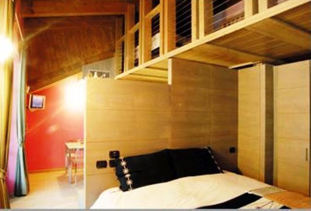 Postel nebo postele na pokoji v ubytování Residence Hotel Serenella
