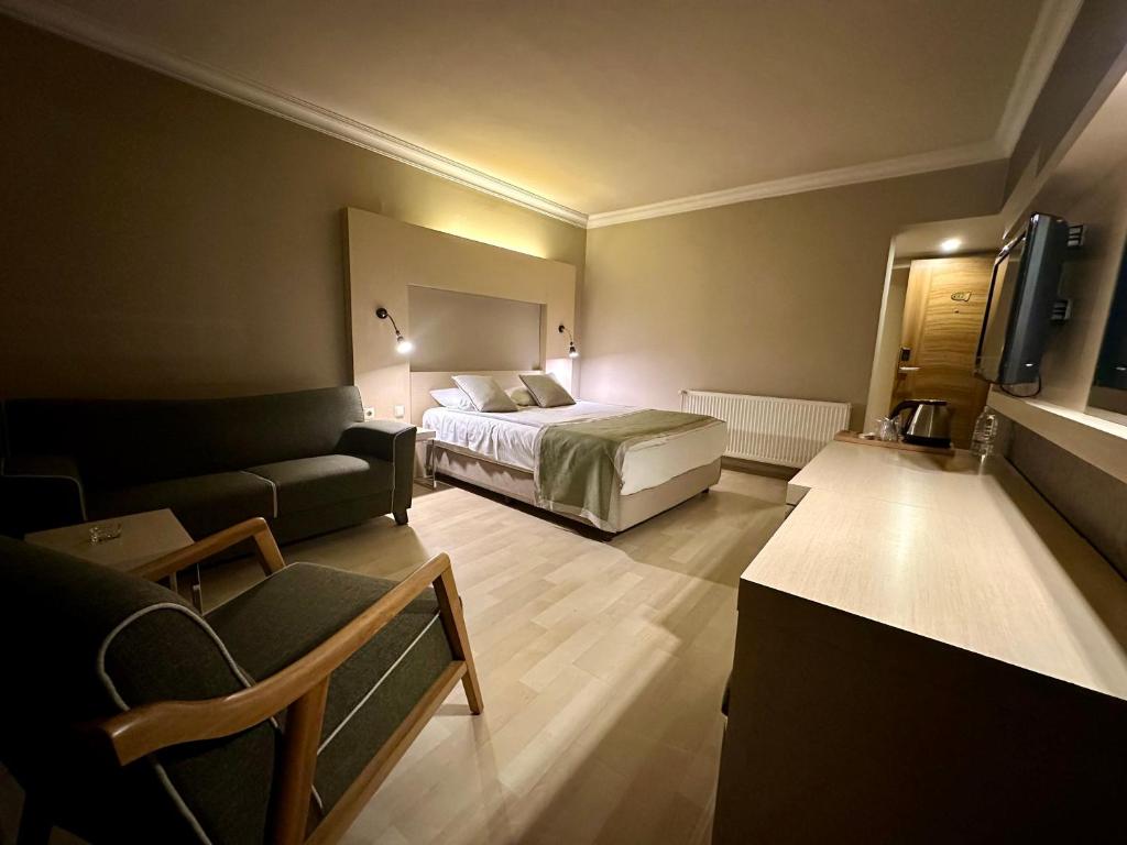 Postel nebo postele na pokoji v ubytování Laodikya Hotel