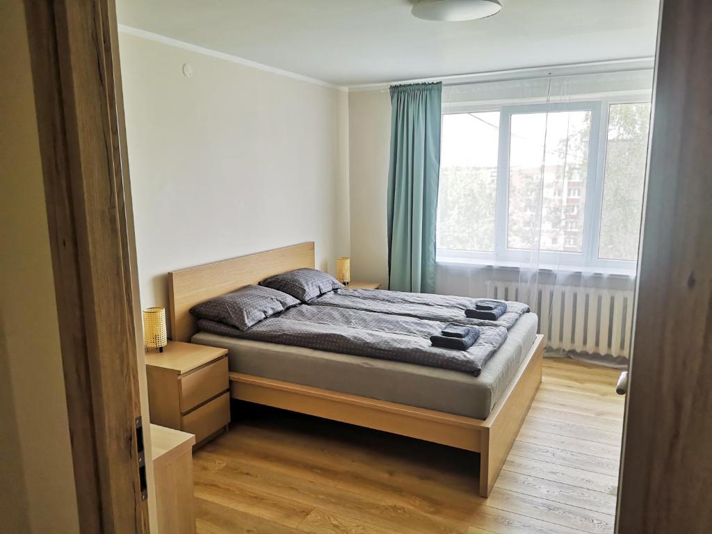 UrboRent 2 kambarių butas Anykščiuose 2 rooms apartmentにあるベッド