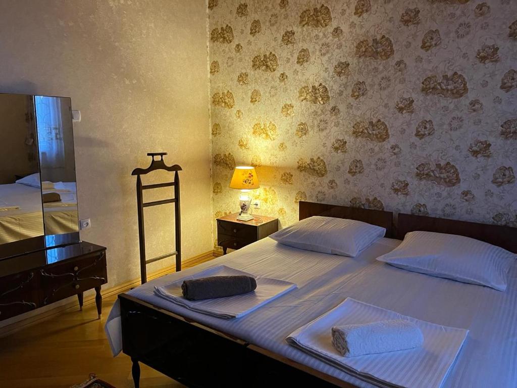 Postel nebo postele na pokoji v ubytování Guest House Levan II Dadiani