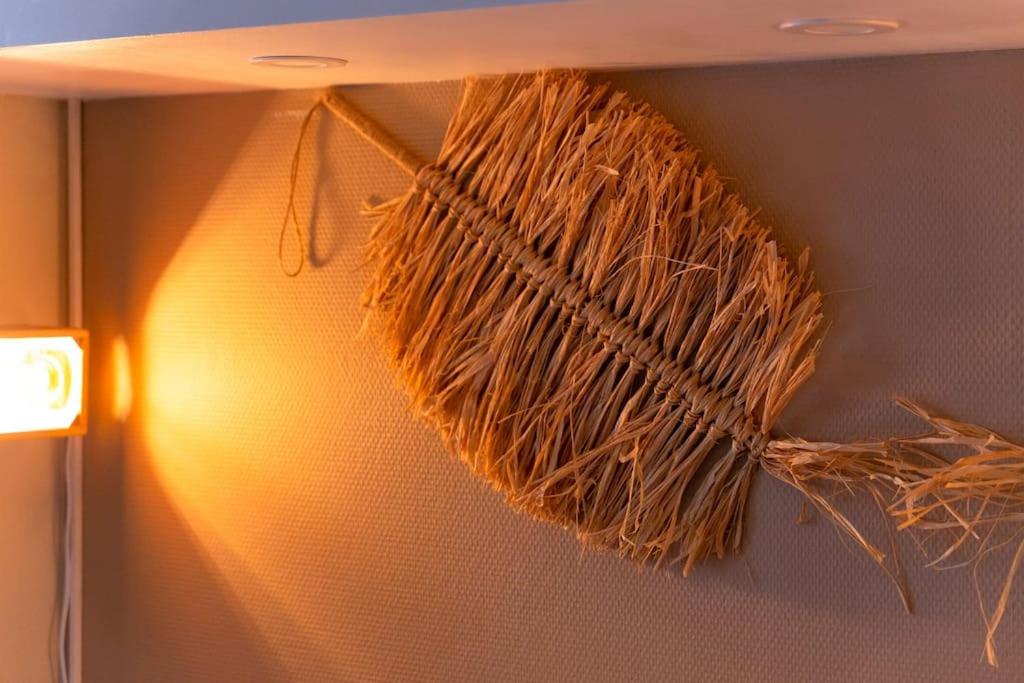 a piece of hay hanging on a wall at La pépite bleue de Nanterre in Nanterre