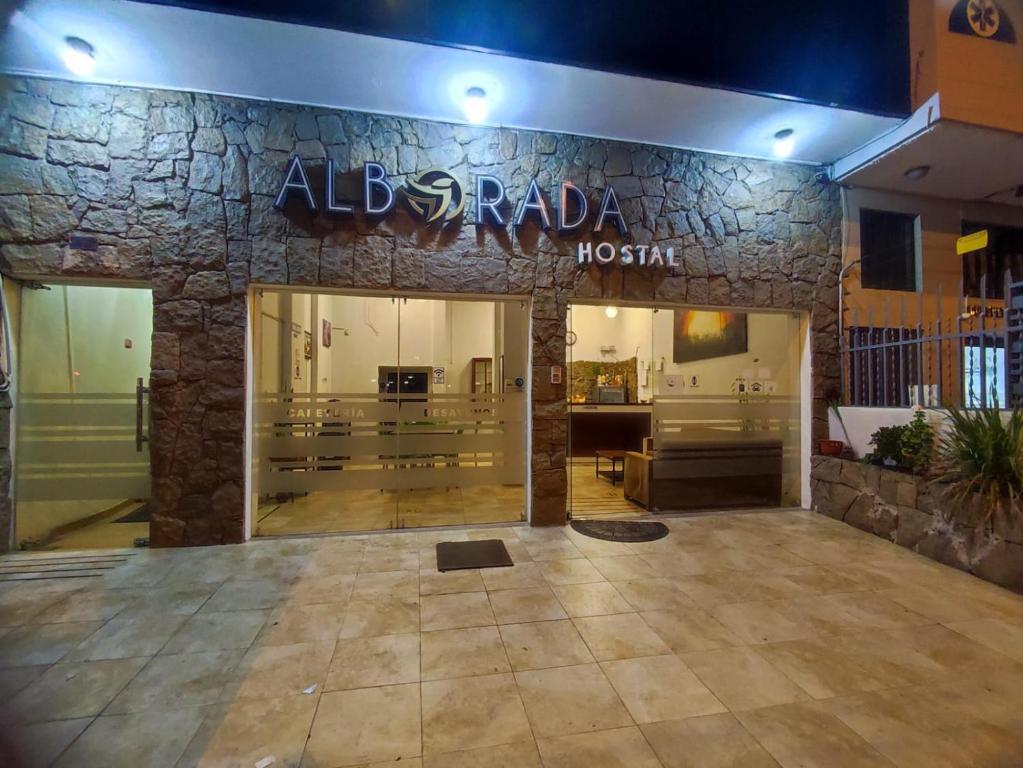 a store front of a hotel with a sign on it at alborada cuenca hospedaje in Cuenca