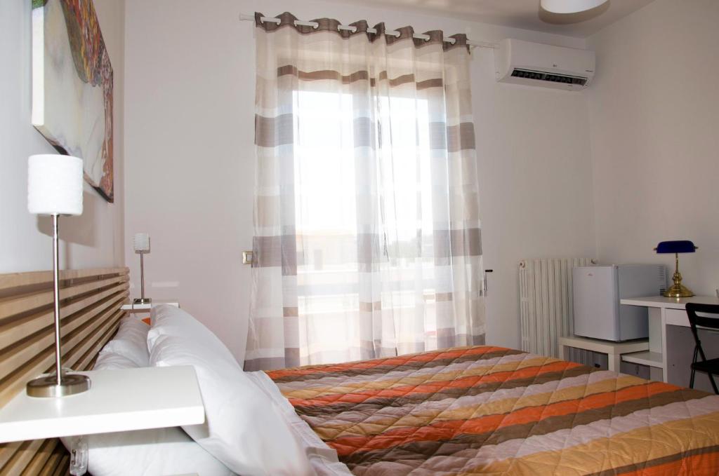 Postel nebo postele na pokoji v ubytování Aliseo B&B