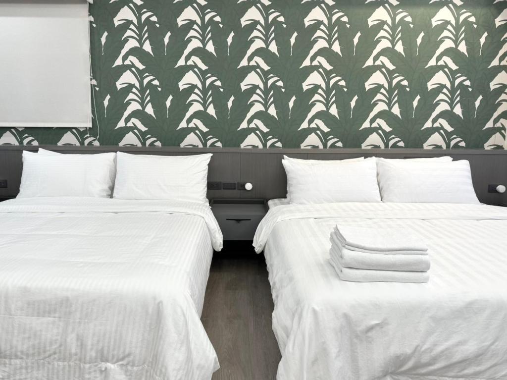 Postel nebo postele na pokoji v ubytování Luodong Park Villa B&B