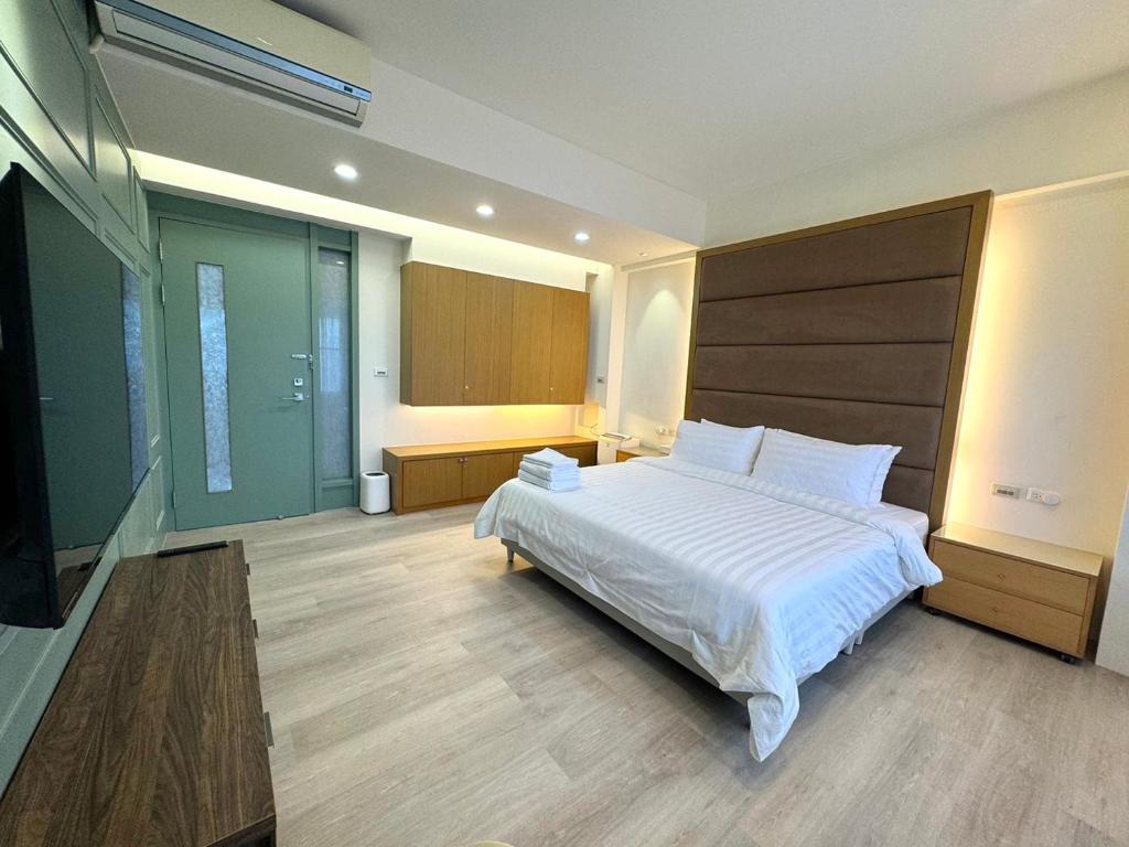 Postel nebo postele na pokoji v ubytování Luodong Park Villa B&B