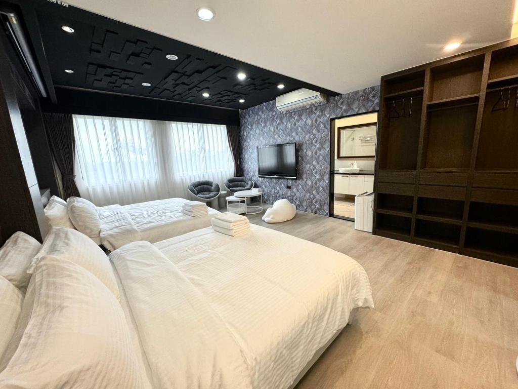 Postel nebo postele na pokoji v ubytování Luodong Park Villa B&B