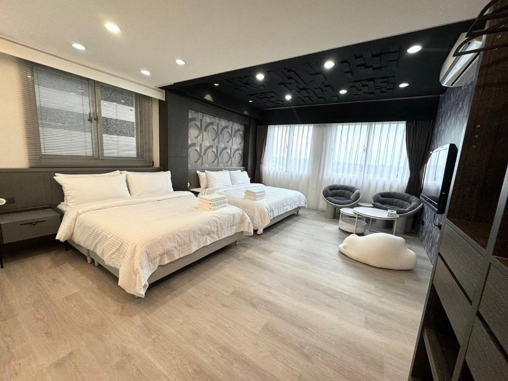 Postel nebo postele na pokoji v ubytování Luodong Park Villa B&B