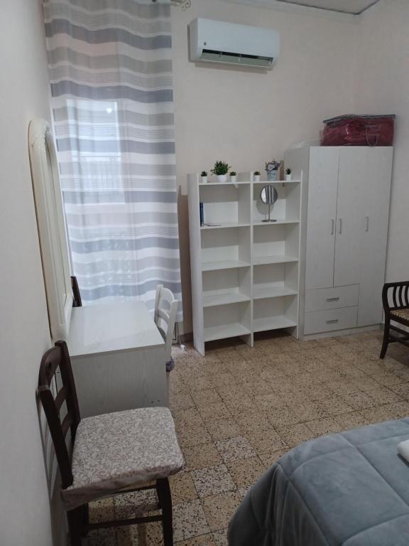 Posteľ alebo postele v izbe v ubytovaní B&B Appartamenti NAPOLI