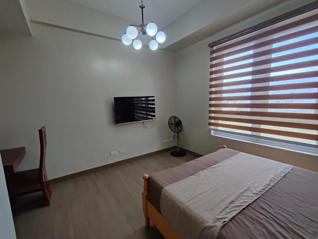 Postel nebo postele na pokoji v ubytování Refreshing Condo hotel