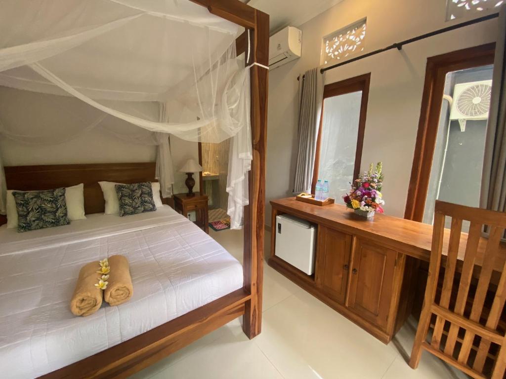 Letto o letti in una camera di GUS ARDITYA HOMESTAY