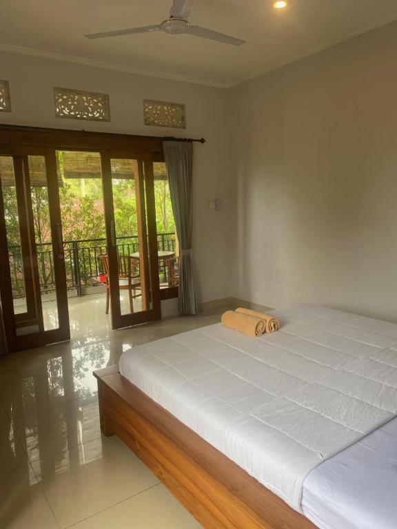 Letto o letti in una camera di GUS ARDITYA HOMESTAY