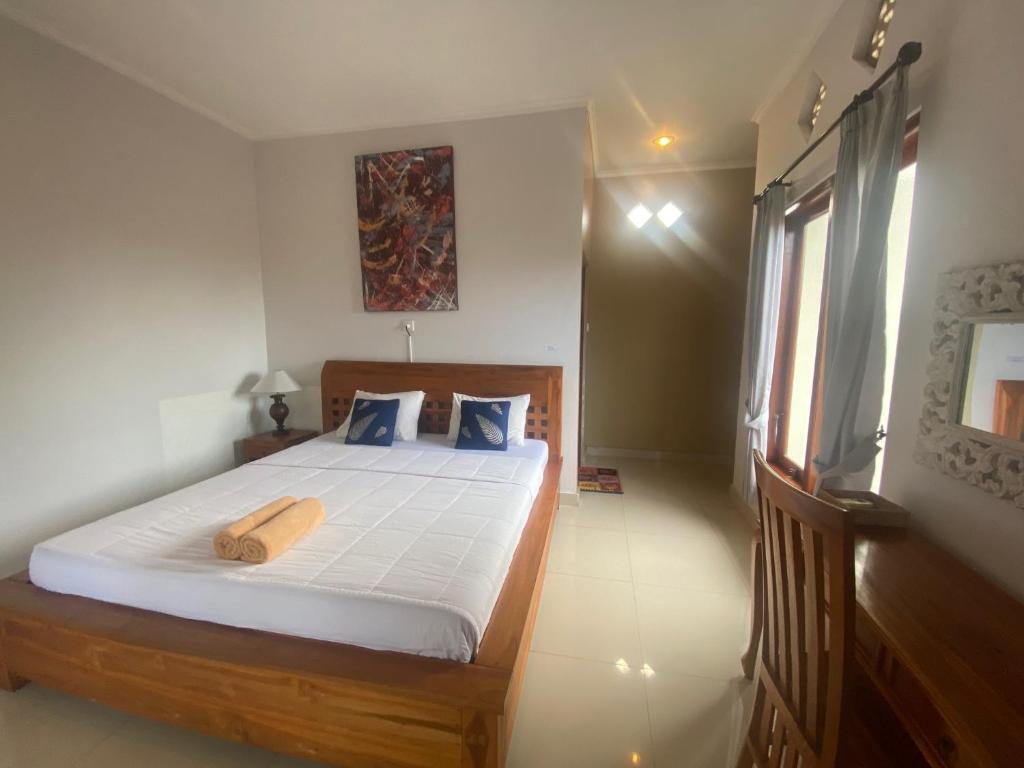 Letto o letti in una camera di GUS ARDITYA HOMESTAY