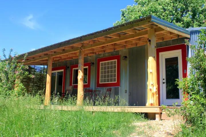 a small house with a red and gray at The Barn House in Eureka Springs
