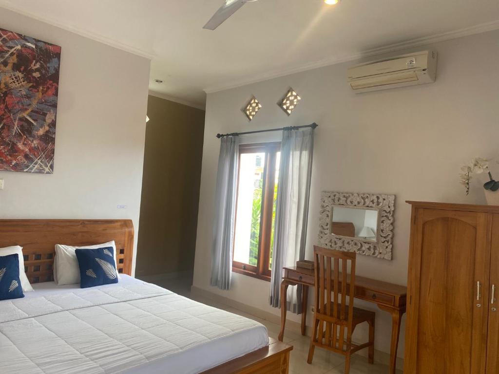 Letto o letti in una camera di GUS ARDITYA HOMESTAY