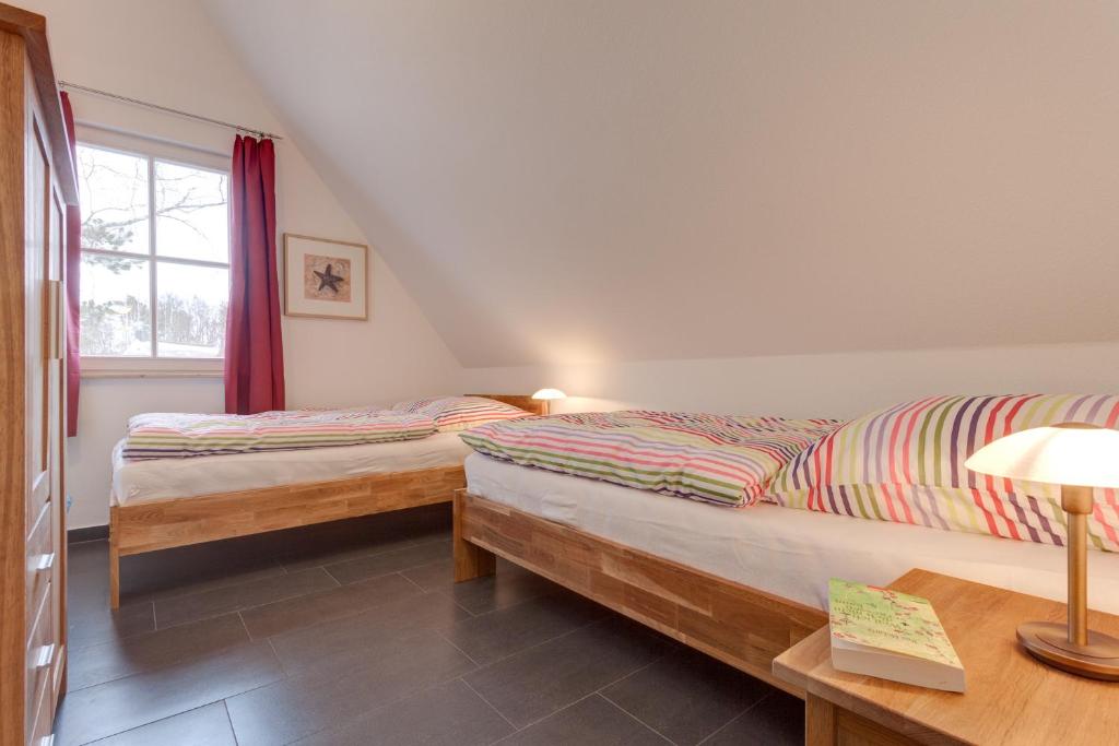 Postel nebo postele na pokoji v ubytování Ferienhaus Inga