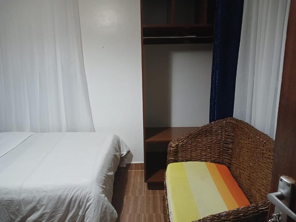 Een bed of bedden in een kamer bij Annodas Homes Milimani Kisumu