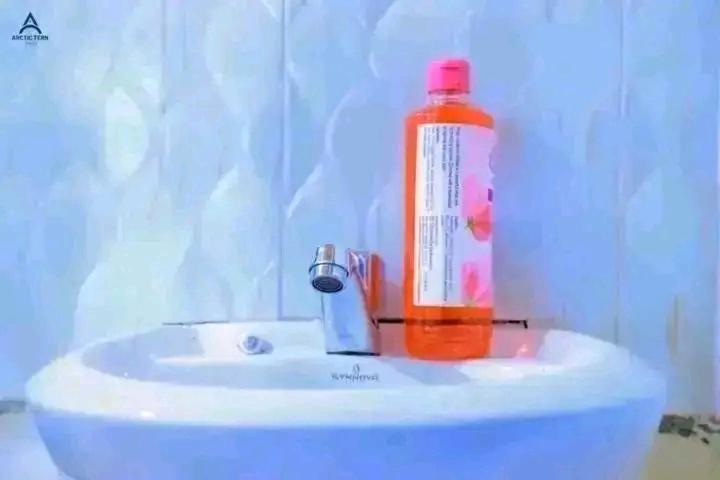 an orange bottle sitting on top of a sink at Arctic Tern airbnb Mwea 