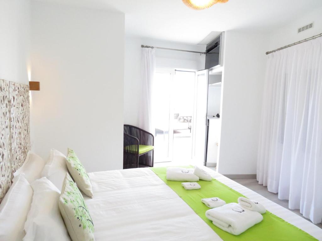 Postel nebo postele na pokoji v ubytování Lua Hotel Boutique