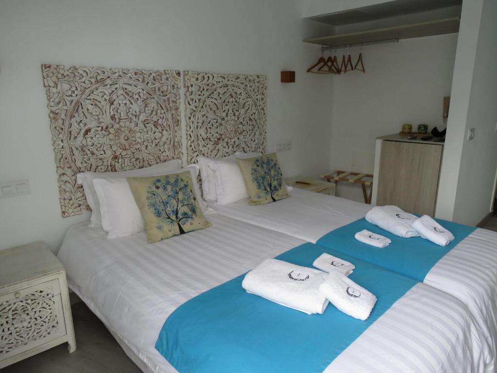 Postel nebo postele na pokoji v ubytování Lua Hotel Boutique