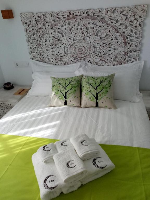 Postel nebo postele na pokoji v ubytování Lua Hotel Boutique