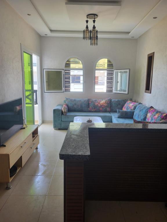 Posezení v ubytování Appartement lumineux avec piscine