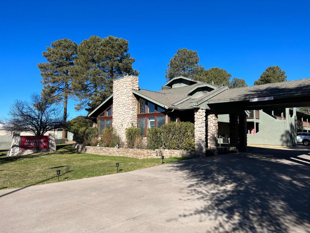 a house with a driveway in front of it at Majestic Mountain Inn in Payson
