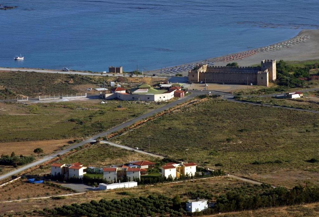 an aerial view of a small town next to the ocean at Monachus Monachus in Frangokastello