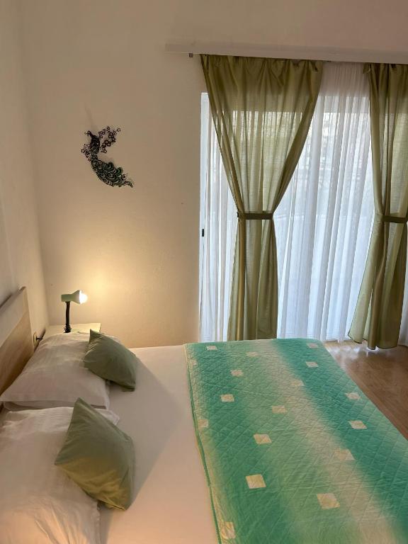 Postel nebo postele na pokoji v ubytování Apartments Valjan