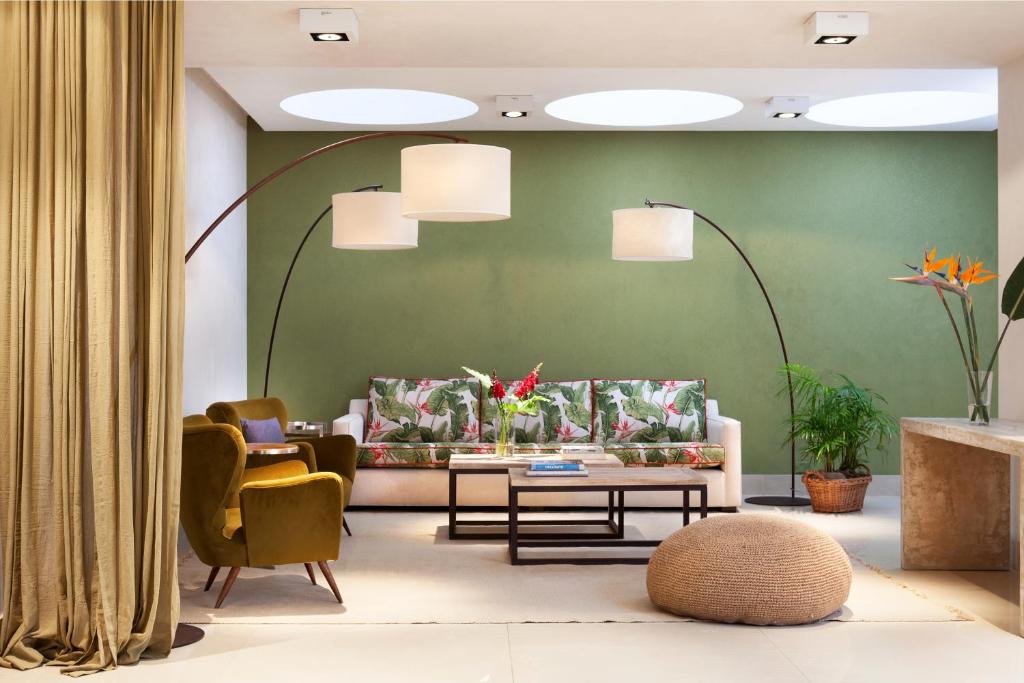 a living room with a couch and chairs at Casa Bevant in Buenos Aires