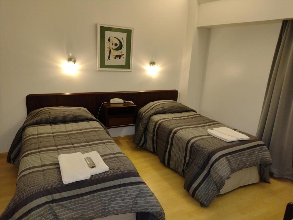 Postel nebo postele na pokoji v ubytování Rosa de los Viajes
