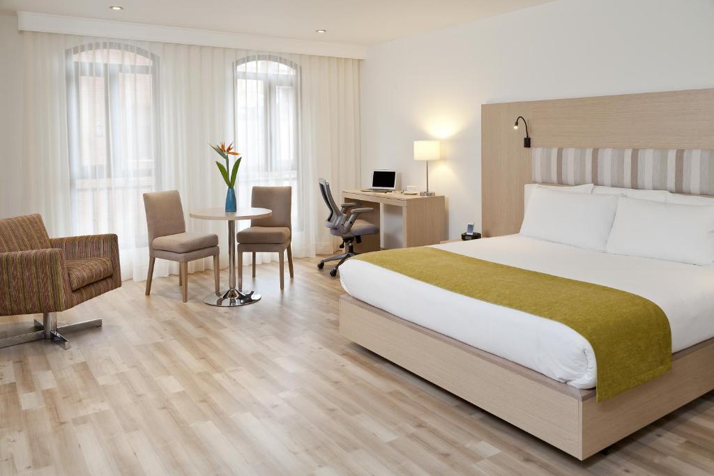 Postel nebo postele na pokoji v ubytování Hotel Rosales Plaza