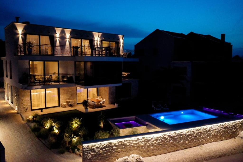an aerial view of a house with a swimming pool at Bonaventura Residence in Murter