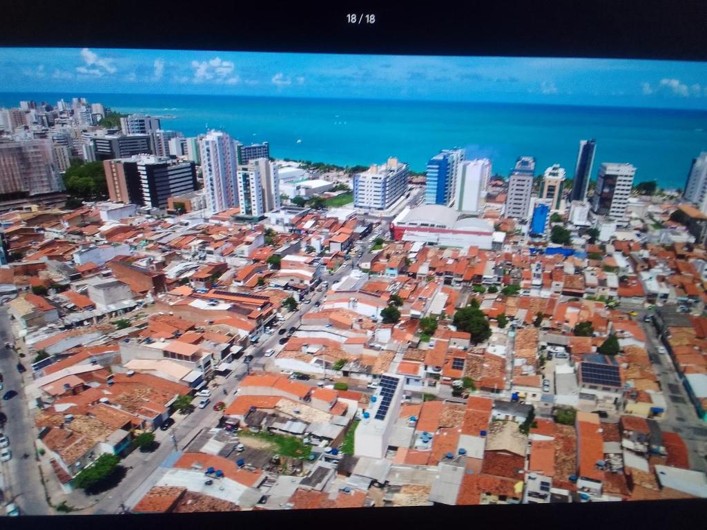 an aerial view of a city with buildings at Sweet home in Maceió