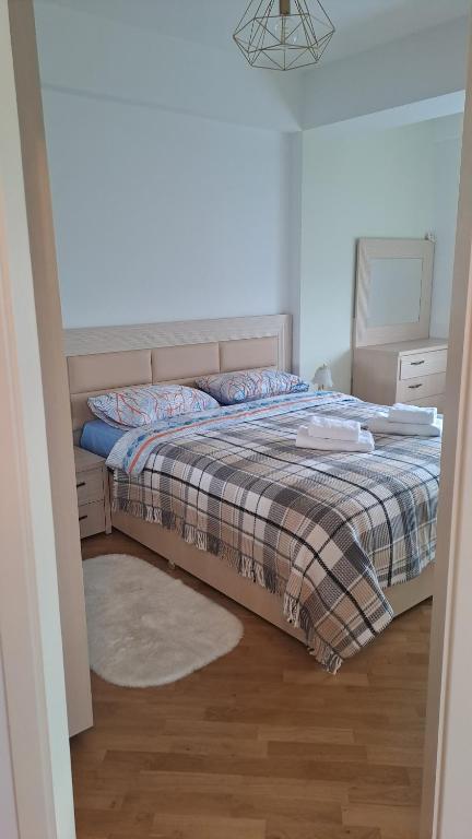 En eller flere senge i et værelse på Аэропорт-Кишинев