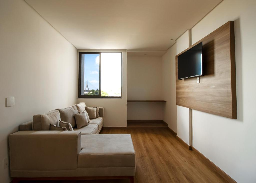TV a/nebo společenská místnost v ubytování Ilhéus Praia Hotel
