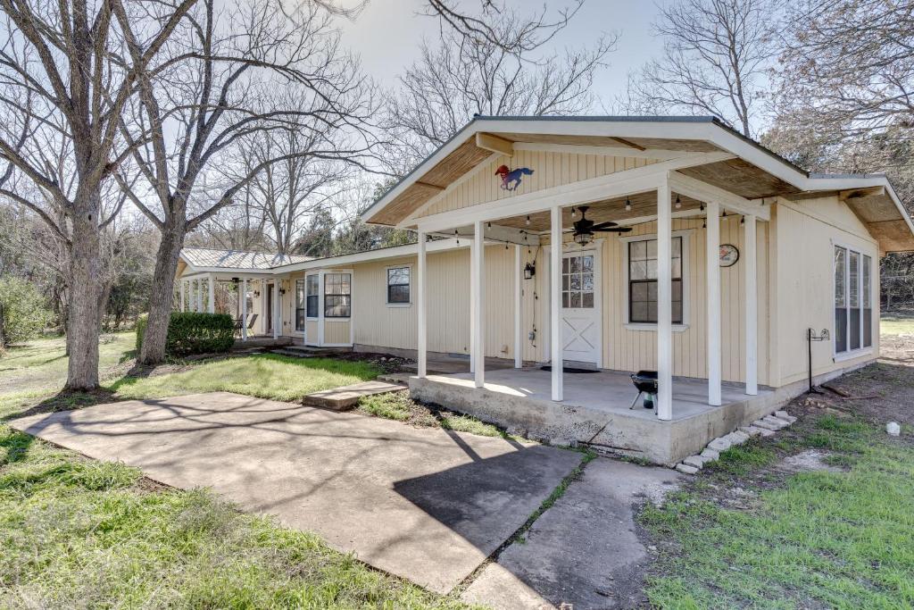 a small white house with a porch at Charming Austin Home on 2 Acres 11 Mi to Dtwn! in Bee Cave